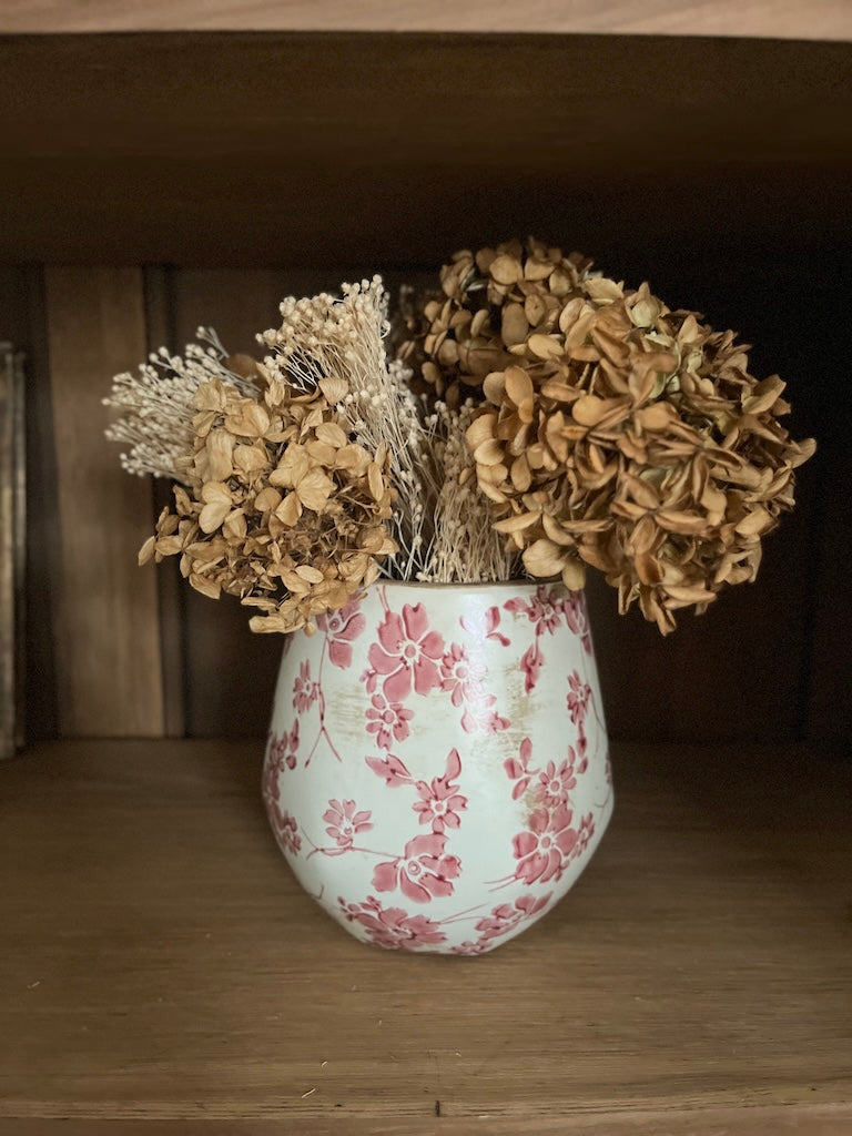 Cache pot fleurs rouges
